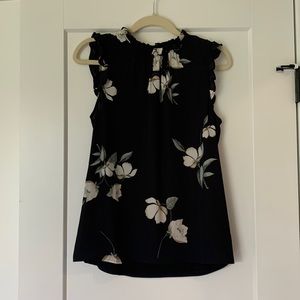 Cute top good for any occasion, simple flower pattern.